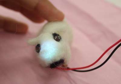 yellow felt band with glowing LEDs